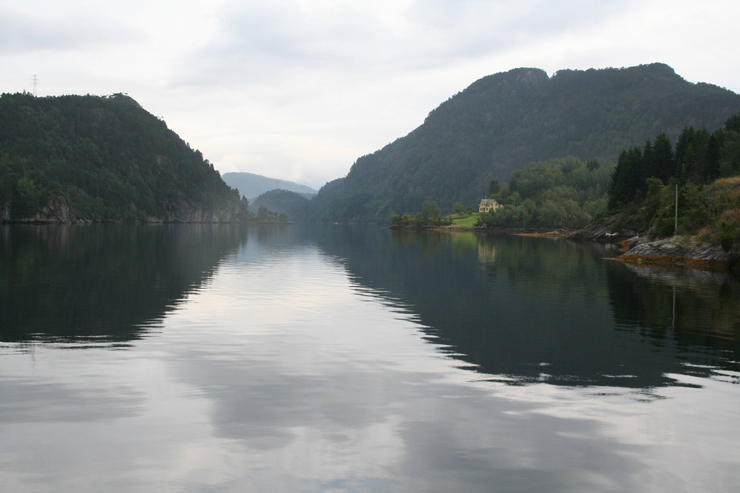 Entering the Norwegian fjords by boat is an absolute thrill. This photograph was taken north of Bergen on a day when the waters were so still, it was hard to imagine the violence of nature that carved out the waterways. 