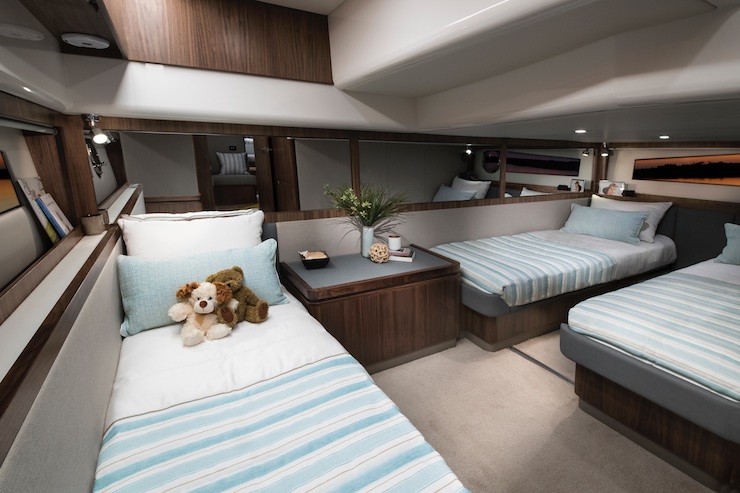 The mid-cabin sleeps three on single beds; the two port-side beds can slide together as a double. 
