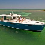 MJM Yachts 53z Outboard Express Cruiser In Shallow Water by island