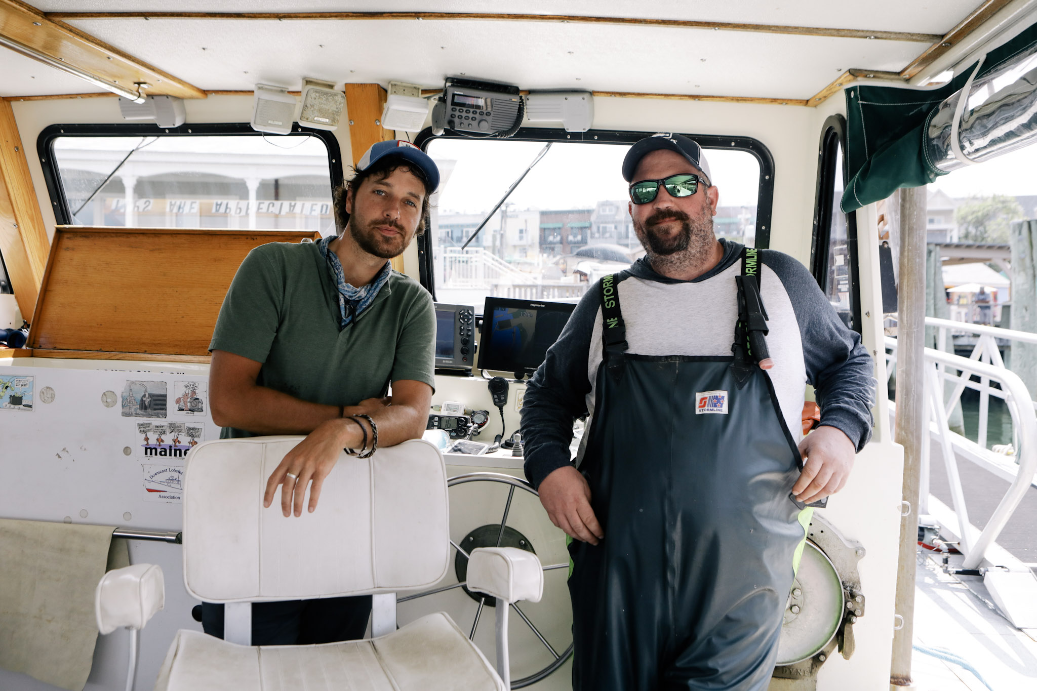 Lobsterman Dallas Hodgkins and Ryan McVinney onboard a Maine lobster boat.