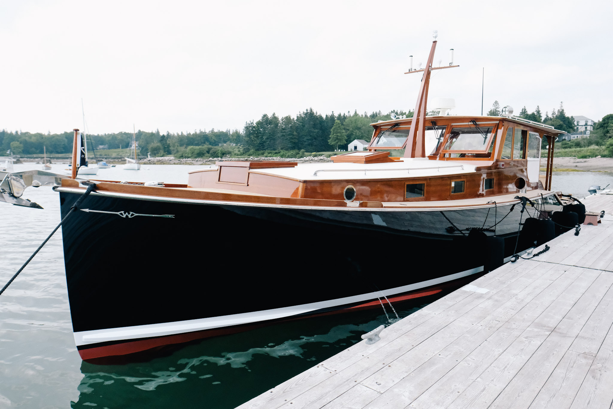 Side View Of A Wooden Vintage Boat In A Harbor Photo Picture And