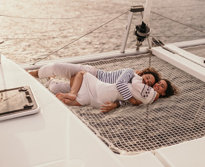 Couple-on-a-catamaran-trampoline