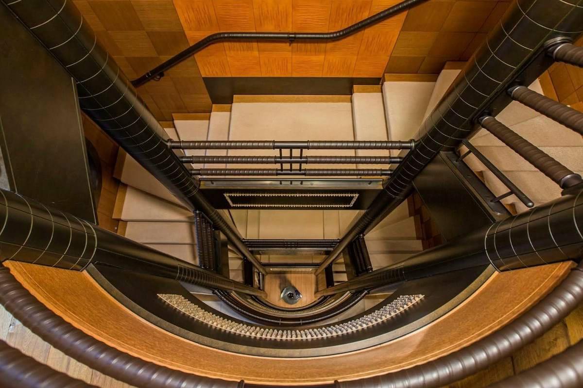 Stairwell on Above: PELORUS a 377-foot Lurssen superyacht on the water. Photo via Burgess London.